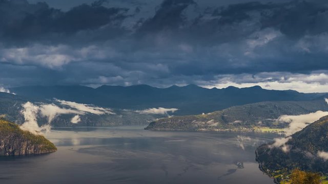 A timelapse of the clouds passing and swirling over the calm waters of the Innvikfjorden.