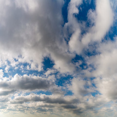 Fantastic clouds against blue sky, square