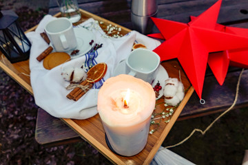 Stockholm, Sweden A tray outside a cafe with candle, coffee cups, gineger snaps, dried oranges to represent a traditonal Swedish fika