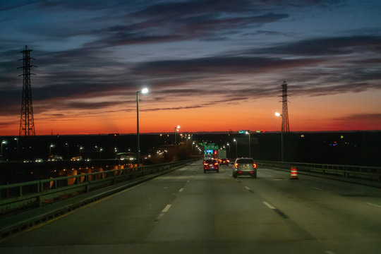 driving over a bridge early morning at sunriseac