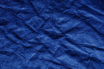 Navy blue trend color 2020, crumpled paper with space for text, background for banner and mock up, no people and horizontal