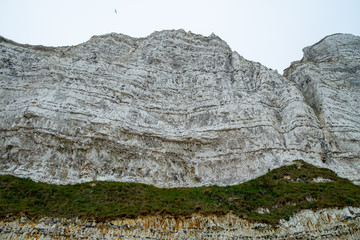 Misty morning landscape of the Natural white chalk cliffs in Etretat, Normandy, France, La Manche or English Channel, on the Coast of the Pays de Caux area. 