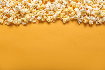 Tasty popcorn on color background