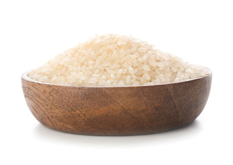 Plate with raw rice on white background