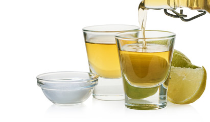 strong drink is poured into a glass