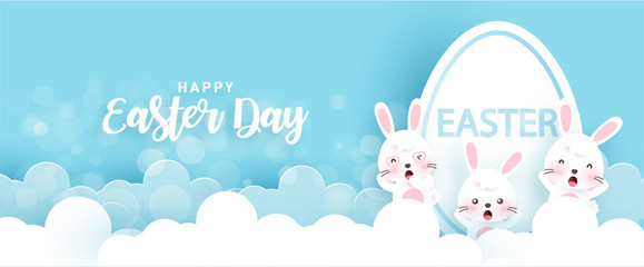 Easter banner with cute rabbits and Easter eggs in paper cut and craft style .