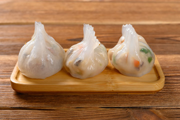 Obraz premium traditional Cantonese style dumplings on a wood table