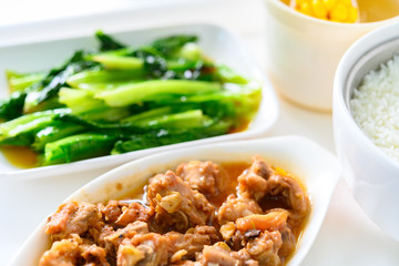 pork ribs and vegetable and maize soup and rice as a meal