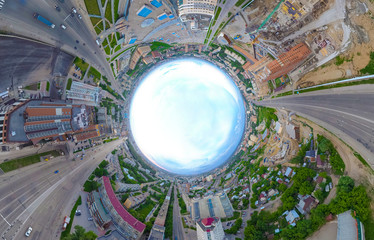 Abstract aerial view of old and new buildings with blue sky in the center in the city with a lot of cars. Russian streets, Novosibirsk.