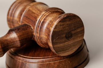 Wooden judges gavel on table close up