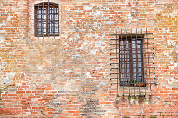 Old textured brick wall, of an ancient house in the hilly Region of Langhe (Piedmont, Northern Italy); this area has been nominated UNESCO site since 2014.