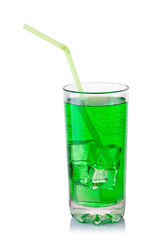 glass with green carbonated drink and ice cubes
