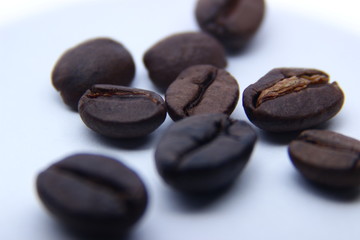 roasted coffee beans isolated in white background