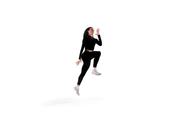 Female athlete running and jumping isolated on white.