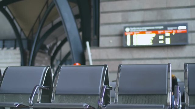 Hipster travelers missing their train and hurrying up not to be late