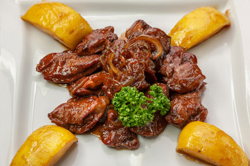  This is a second course of baked meat and potatoes.