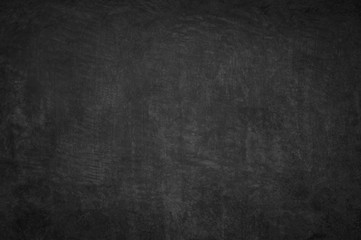Dark concrete textured wall background.black cement wall texture for interior design. dark edges.copy space for add text.