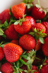 Fresh red organic strawberries closeup, background of berries