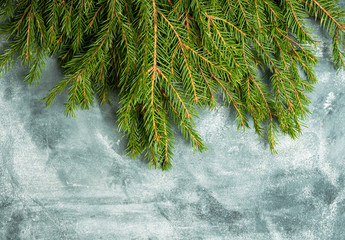 Christmas background with pine branches on the rustic background. Selective focus. Shallow depth of field.