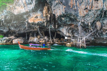 Fototapeta na wymiar Landscape of Viking cave with longtail boat for traveler Phi Phi island Krabi, Famous landmark tourist travel Phuket Thailand summer holiday vacation trips, Tourism beautiful destinations place Asia