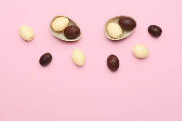 Chocolate Easter eggs on color background