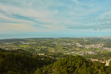 panorama of mountains with trees and clouds