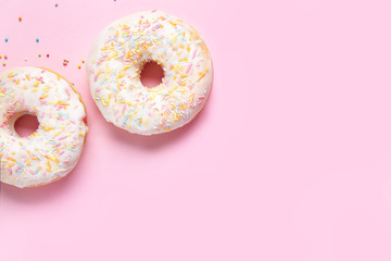 Sweet tasty donuts on color background