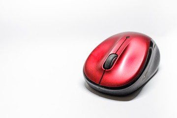 Modern red computer mouse on a white background