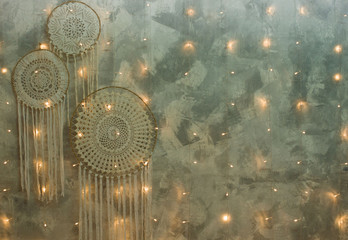 Beautiful dream catcher on the wall with lights. Boho handmade.