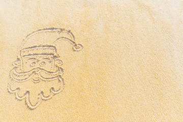 Concept Christmas on the beach Tropical design made in Phuket, Thailand Write the alphabet on the sand background Taken from real locations.