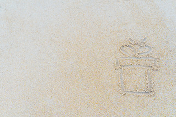 Concept Christmas on the beach Tropical design made in Phuket, Thailand Write the alphabet on the sand background Taken from real locations.
