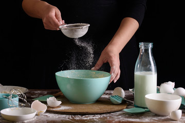 The process of baking delicious muffins with berries, white cream, chocolate.