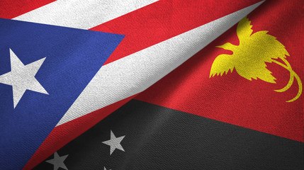 Fototapeta premium Puerto Rico and Papua New Guinea two flags textile cloth, fabric texture