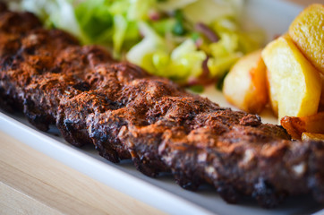 delicious smoked ribs with french fries & lettuce