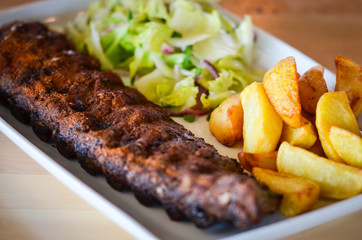 delicious smoked ribs with french fries & lettuce