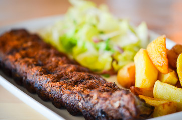 delicious smoked ribs with french fries & lettuce