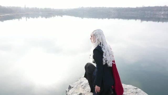 Beautiful girl in a blonde wig and a fantasy costume.