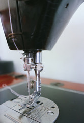 Sewing machine and thread rolling