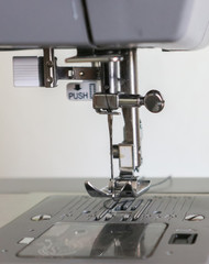 Sewing machine and thread rolling