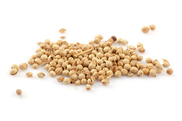 Pile of coriander seeds isolated on white background.