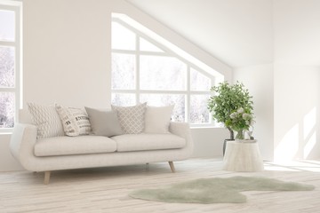 Fototapeta premium Stylish room in white color with sofa and winter landscape in window. Scandinavian interior design. 3D illustration