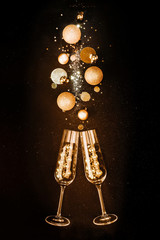 Christmas composition. Glasses with champagne wine from gold festive decorations on a black background with glitters. The concept of a party and a festive feast © Irina_Evva