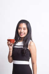 Young Asian woman drink tomato juice
