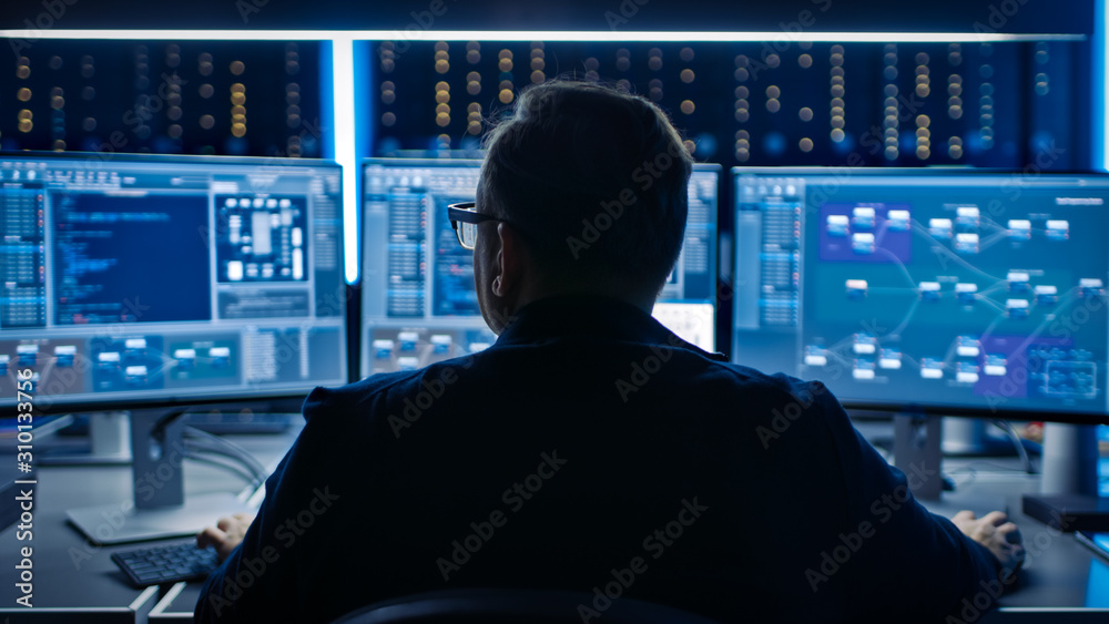 Poster Professional IT Programer Working in Data Center on Desktop Computer with Three Displays, Doing Development of Software and Hardware. Displays Show Blockchain, Data Network Architecture Concept