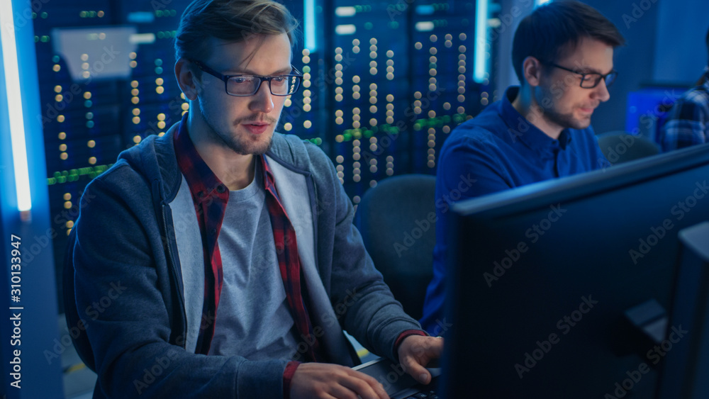 Poster Team of Young IT Programers Working on Desktop Computers in Data Center System Control Room. Displays Show Concept: Software Development / Code Writing / Database Architecture. Technical Department