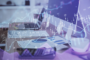 Financial graph colorful drawing and table with computer on background. Double exposure. Concept of international markets.