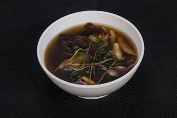 Thai style soup with meat and mushrooms