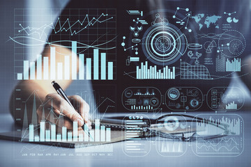 Multi exposure of woman's hands making notes with forex graph hologram. Concept of technical...