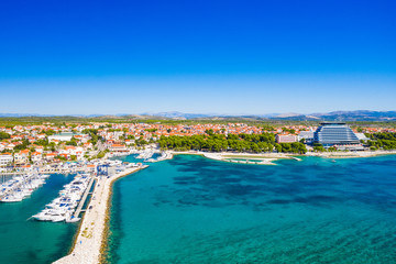 Yachting marina in town of Vodice and amazing turquoise coastline on Adriatic coast, aerial view, Croatia