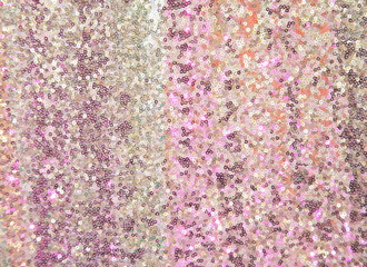 Colorful sequins - sparkling sequined textile, blurred